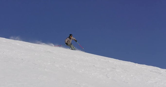 Slow Motion  Of Professional Skier Spraying Fresh Snow Close To Camera