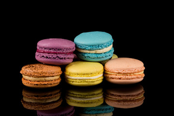 Colorful macaroon over black background