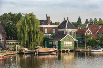 Fototapeta na wymiar The Zaanse Schans with its typical green wooden houses, bridges