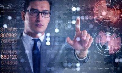Businessman pressing virtual buttons in futuristic concept