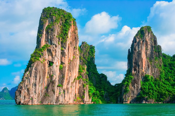 Scenic view of rock island in Halong Bay, Vietnam, Southeast Asia. UNESCO World Heritage Site. Mountain islands at Ha Long Bay. Beautiful landscape Popular asian landmark famous destination of Vietnam