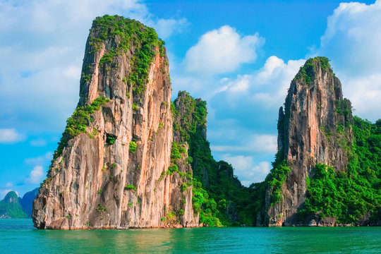 Scenic view of rock island in Halong Bay, Vietnam, Southeast Asia. UNESCO World Heritage Site. Mountain islands at Ha Long Bay. Beautiful landscape Popular asian landmark famous destination of Vietnam