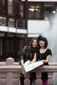 Tourists with a map at Yu Yuan Garden, Huangpu District, Shanghai, China