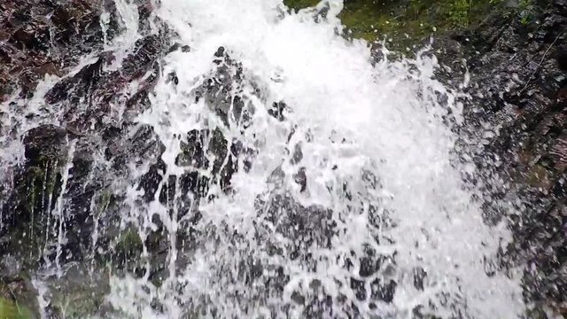 Close up of the water crashing down the rocks of the Carpathian mountains.