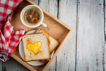 Idea for the celebration of Valentine's day: breakfast - toast with scrambled eggs in the form of...