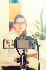 Video camera blog recording. Vlog blogger woman.