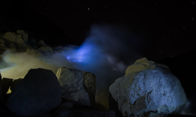 Blue light is seen through the haze of fumes from the volcano (Indonesia)