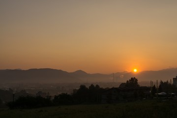 Naklejka na ściany i meble Sunrise over the town. Slovakia