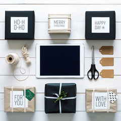 Elegant nordic retro christmas, wrapping station, desk view from above, online shopping concept