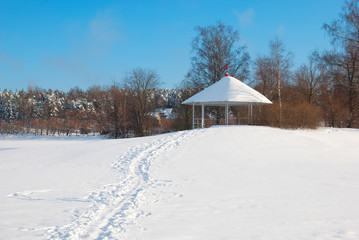 Fototapeta na wymiar Lappeenranta. Finland. Winter landscape with pavilion on Halkosaari Island. Located in Lappeenranta Harbor on Saimaa Lake
