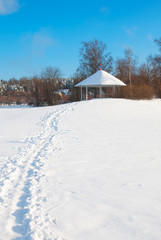 Fototapeta na wymiar Lappeenranta. Finland. Winter landscape with pavilion on Halkosaari Island. Located in Lappeenranta Harbor on Saimaa Lake