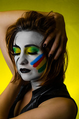Sensual girl with colorful bodyart and face art       