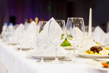 Three glasses on a festive table. Serving at the party. Soft foc
