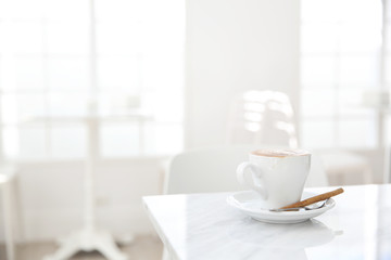 Fototapeta na wymiar cappuccino coffee on wood background