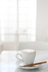 cappuccino coffee on wood background