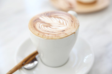 cappuccino coffee on wood background