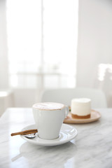 Fototapeta na wymiar cappuccino coffee on wood background