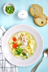 Chicken soup with homemade egg noodle.Top view.