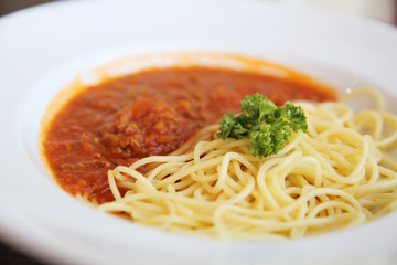 spaghetti bolognese in wood background