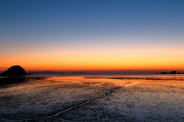 sunset over mud field