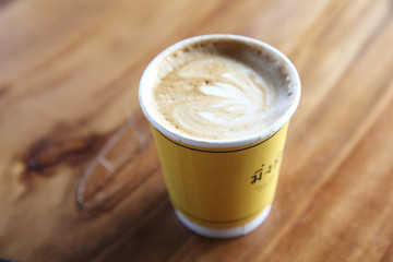 cappuccino coffee on wood background