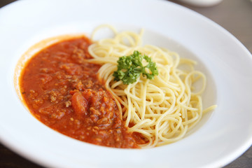 spaghetti bolognese in wood background