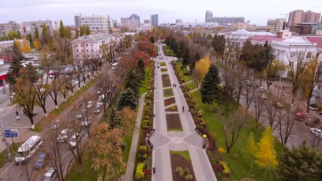 Aerial view of the russian southern city - Krasnodar. A pedestrian path. City park. 4K