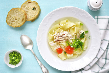 Chicken soup with homemade egg noodle.Top view.
