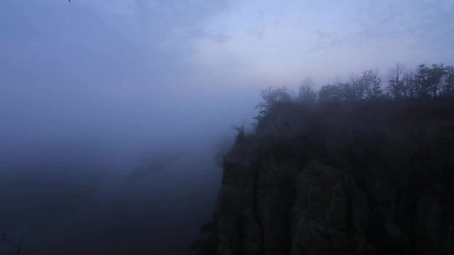 Beautiful foggy morning movement on the red Cliff in Chiang Mai,Thailand.