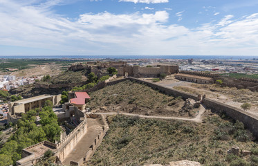 Fototapeta na wymiar Sagunto Roman fortification castle near Valencia Spain Panoramic view, the old Roman theater restored to the left, in the background the Sagunto port
