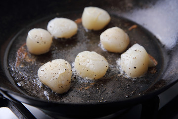 Scallops fried in pan