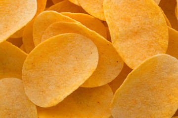 Close up potato chips on wood top view background.