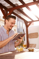 Dark and handsome guy with tablet