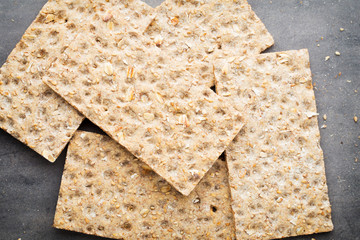 Stack of wholegrain crispy bread with sunflower, chia and sesame