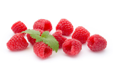 Ripe raspberry with leaf isolated on the white background.