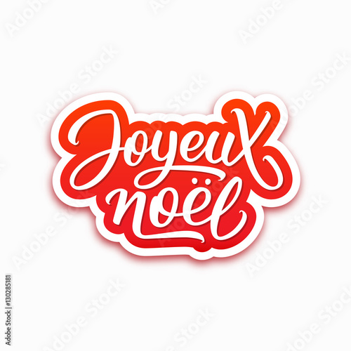 "Joyeux Noel text on paper label with hand lettering over white