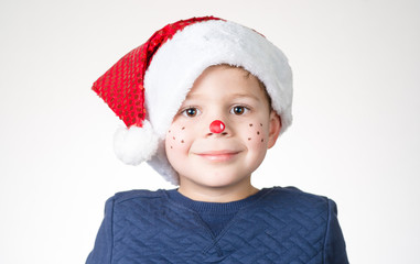 lovely adorable kid with paintings on his face for Christmas