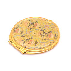 round pocket mirror with pattern isolated on white