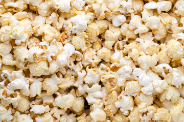 Popcorn background. Caramel sweet corn. Cinema snack.