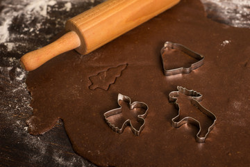 Cutting gingerbread with metal molds. 