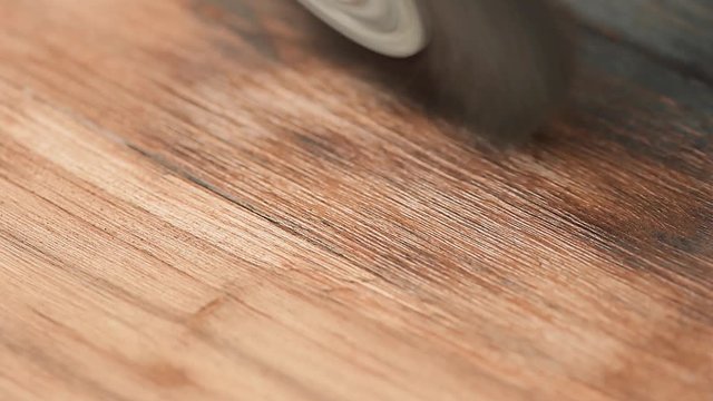 Grinding wooden surface with a metal disc brush. With sound
