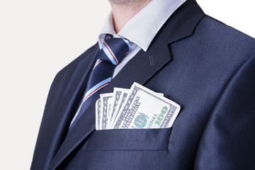 Money in the pocket of business suit