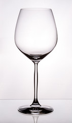 1 glass of red wine, burgundy, empty.