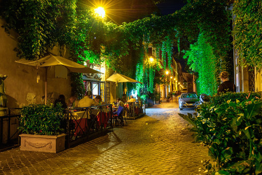 Night view of cozy street in Rome, Italy