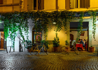Fototapeta na wymiar Night view of old cozy street in Trastevere in Rome, Italy