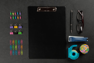Black clipboard on a table
