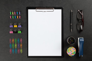 Black clipboard on a table