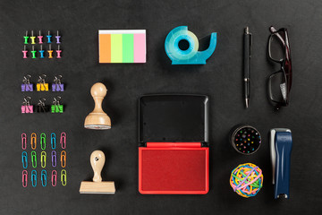Office supplies on a black table