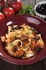 Italian pasta with mussels and olives