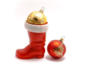 Red Christmas boots with two christmas balls with gold pattern and red isolated on white background